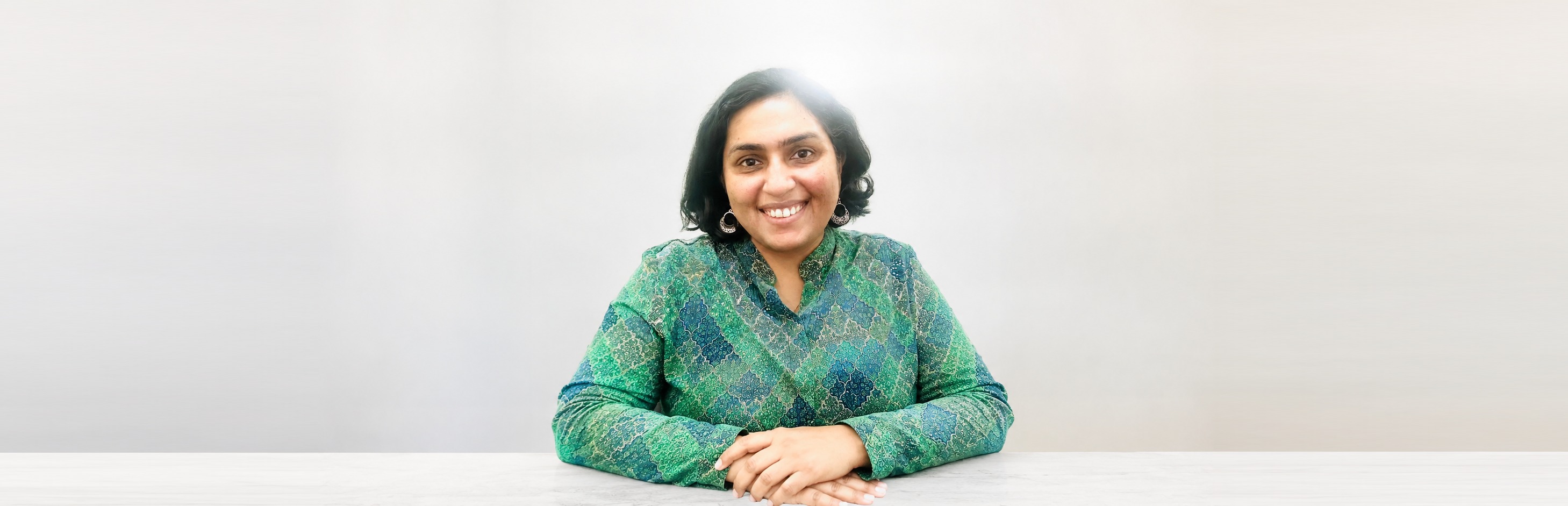 Dr. Swati Rajagopal, seated studio portrait